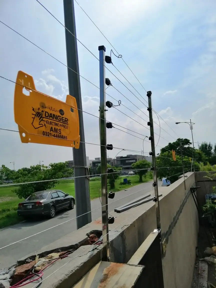 6-strand electric fence on DHA Lahore boundary wall installed by AMS Security Vision