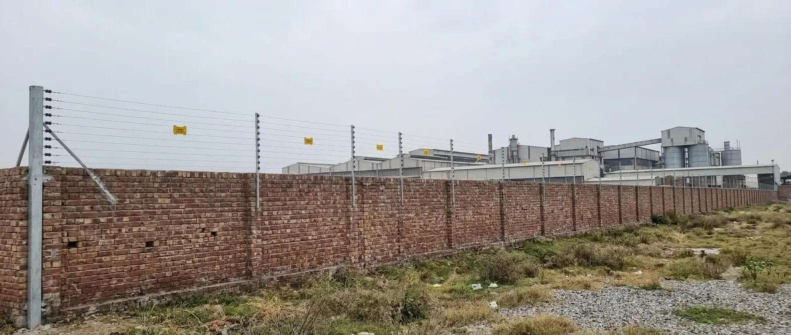 6-strand electric fence on DHA Lahore boundary wall installed by AMS Security Vision